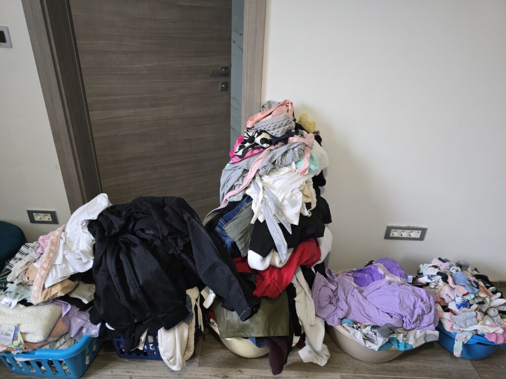 Clean laundry sorted into baskets by category